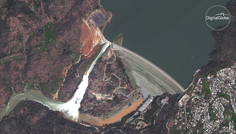 The two spillways during the overflow (main at right, auxiliary at left). (Image: DigitalGlobe)
